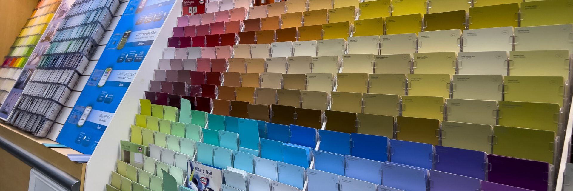 Seattle, WA USA – circa December 2022: Angled view of paint swatch cards inside the paint department inside a Walmart store.