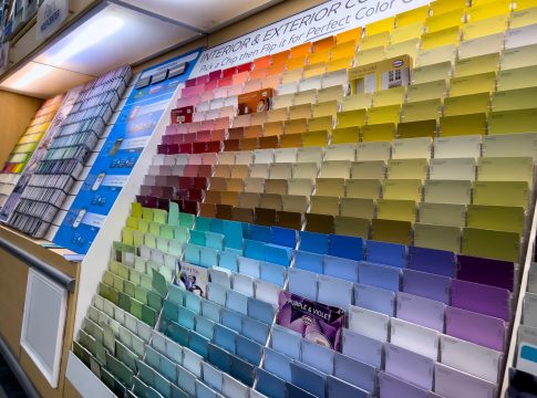 Seattle, WA USA – circa December 2022: Angled view of paint swatch cards inside the paint department inside a Walmart store.