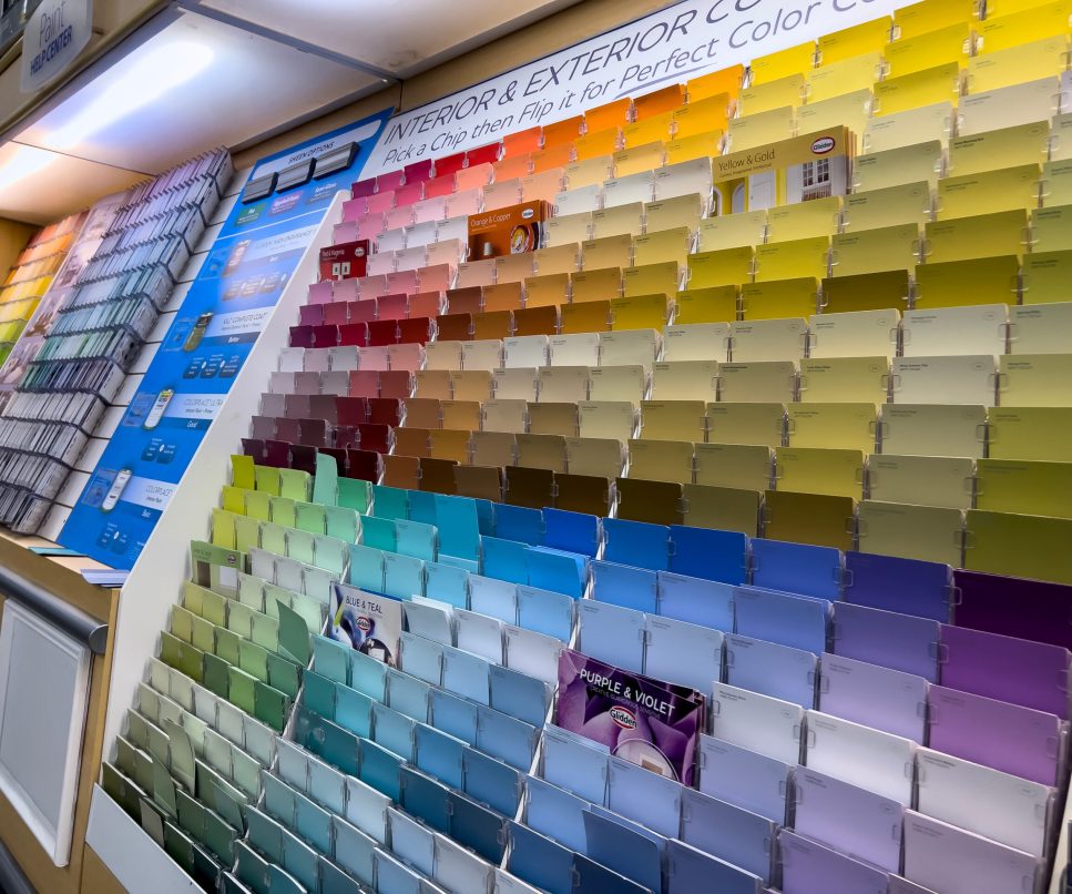 Seattle, WA USA – circa December 2022: Angled view of paint swatch cards inside the paint department inside a Walmart store.